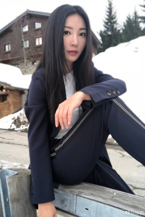 Black, Clothing, Beauty, Black hair, Sitting, Street fashion, Long hair, Footwear, Jacket, Outerwear, 