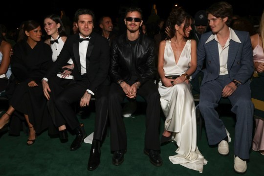 Eva Longoria, Nicola Peltz, Romeo Beckham, Jackie Apostel, and Cruz Beckham sit front row at a Paris Fashion Week show