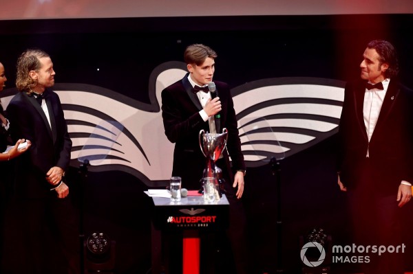 Luke Browning celebrates winning the Aston Martin Autosport BRDC Award with Sebastian Vettel and Dario Franchitti