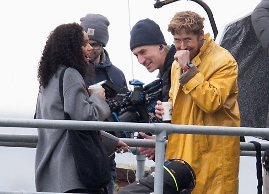 Hollywood film star Ryan Gosling was spotted filming his latest movie at the end of South Parade Pier in Southsea, Hampshire today. Dozens of film trucks and minibuses were parked up nearby with people flocking to the location to try and get a glimpse of the actor. He could be filming Project Hail Mary, a science fiction movie where he plays a school-teacher-turned-astronaut. The actor was wearing a long bright yellow coat with jeans, a striped short and red tie along with spectacles and headphones, he was seen during filming getting a phone out of his pocket and had a joke with his co-star and crew at the end of a scene. Where they were filming, at the end of the pier there were fishermen and many crew members. Dated 13/10/24. Please credit: Paul Jacobs/pictureexclusive.com Standard reproduction rates apply, contact Paul Jacobs, Picture Exclusive to arrange payment - 07923 866166, pictureexclusive@gmail.com
