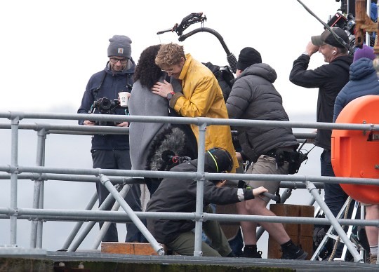 Hollywood film star Ryan Gosling was spotted filming his latest movie at the end of South Parade Pier in Southsea, Hampshire today. Dozens of film trucks and minibuses were parked up nearby with people flocking to the location to try and get a glimpse of the actor. He could be filming Project Hail Mary, a science fiction movie where he plays a school-teacher-turned-astronaut. The actor was wearing a long bright yellow coat with jeans, a striped short and red tie along with spectacles and headphones, he was seen during filming getting a phone out of his pocket and had a joke with his co-star and crew at the end of a scene. Where they were filming, at the end of the pier there were fishermen and many crew members. Dated 13/10/24. Please credit: Paul Jacobs/pictureexclusive.com Standard reproduction rates apply, contact Paul Jacobs, Picture Exclusive to arrange payment - 07923 866166, pictureexclusive@gmail.com