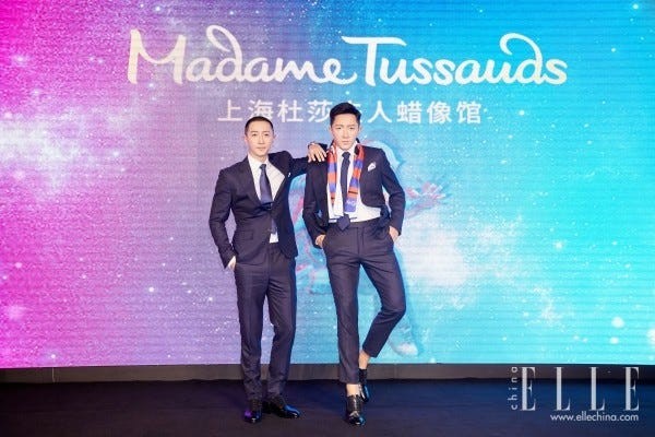 Fashion, Performance, Event, Font, Electric blue, Talent show, Fashion design, Suit, Music artist, World, 
