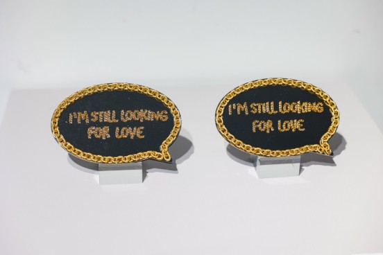 two speech bubbleshaped artworks expressing a sentiment about love