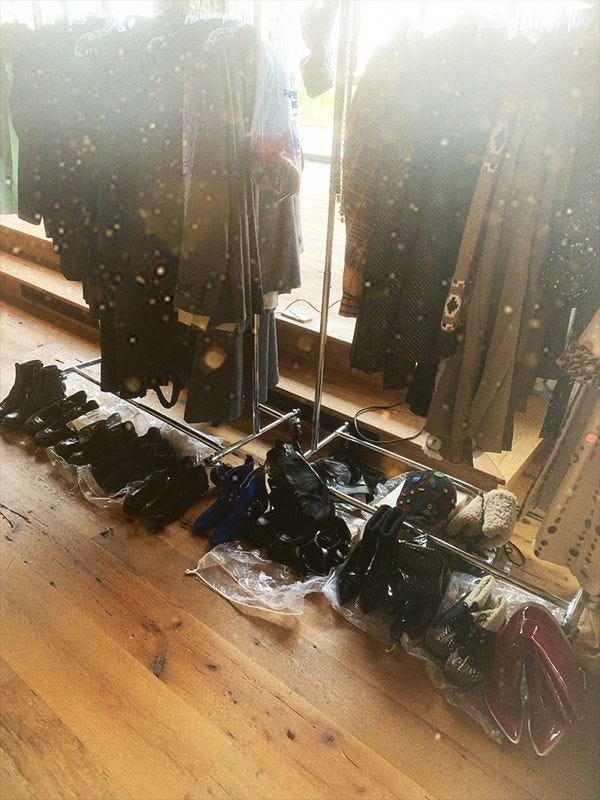 collection of various shoes and clothing on display