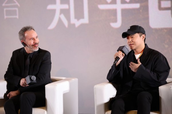 a couple of men sitting in chairs