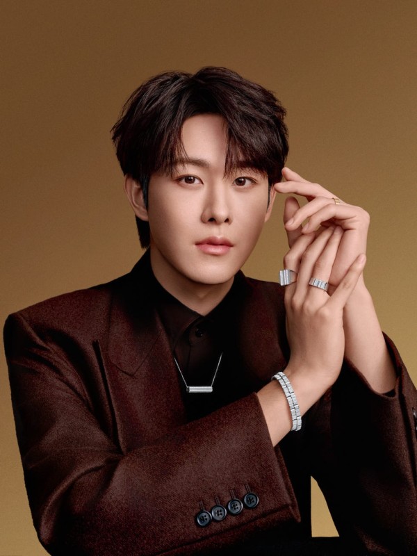 person showcasing jewelry with a neutral background