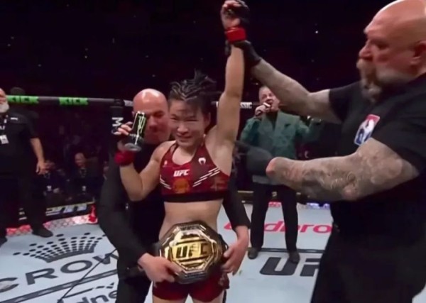 张伟丽握紧的饮料罐，为何愿掷九位数在八角笼中留下爪痕？