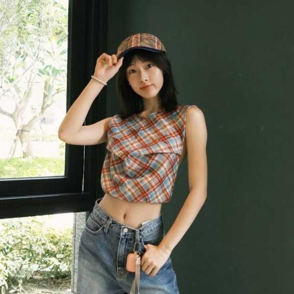 portrait of a person dressed in a stylish outfit indoors